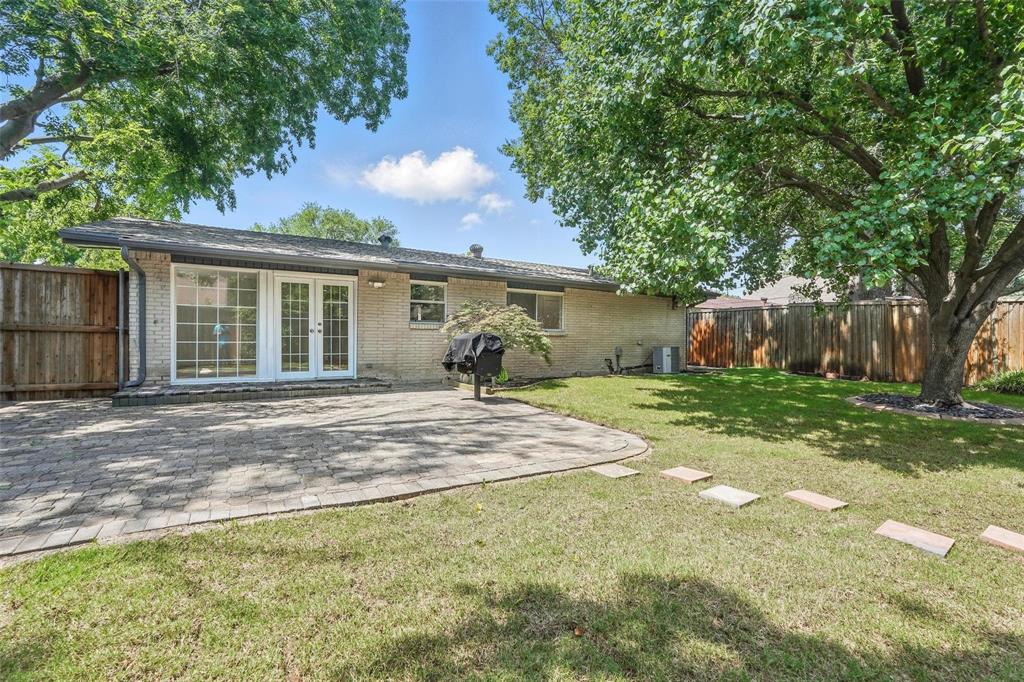 Large fenced yard with sprinkler system