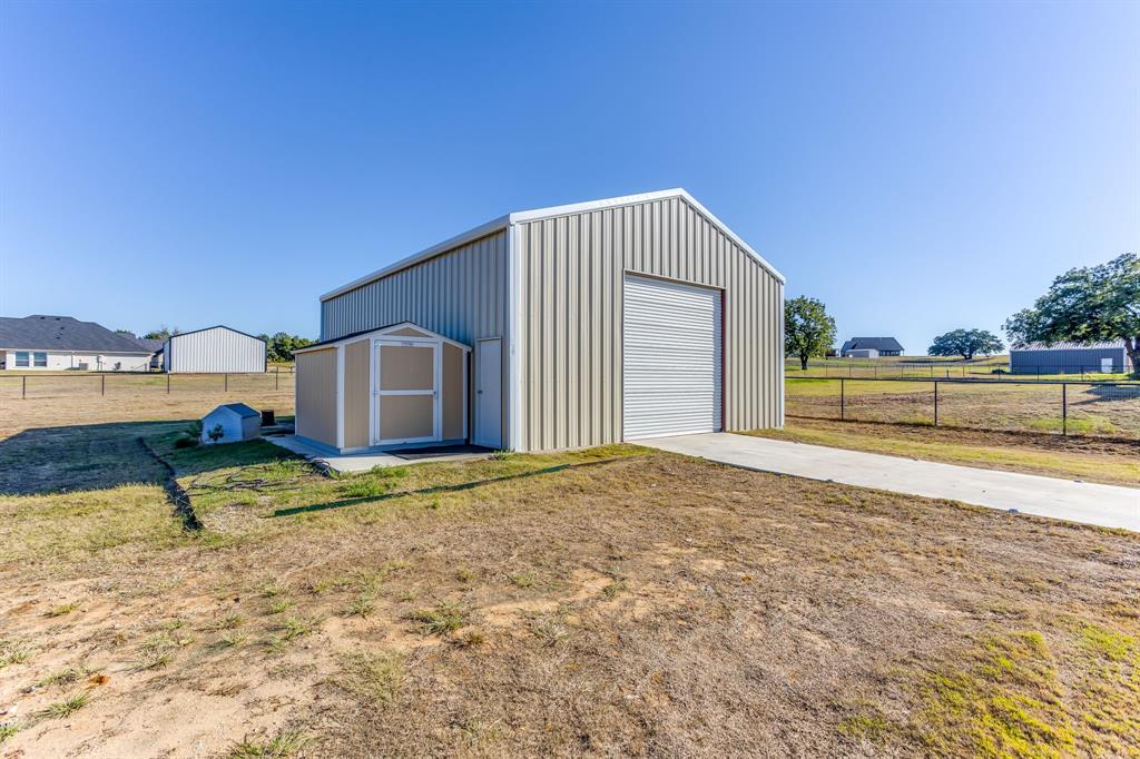Workshop has overhead doors on both ends