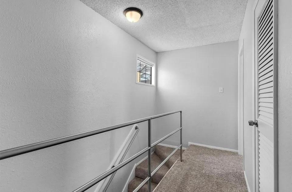 A well-lit second floor hallway
