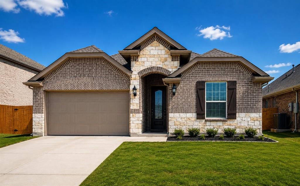 Brick and stone exterior featuring an arched entryway, decorative window shutters, and a two-car garage Brick and stone exterior featuring an arched entryway, decorative window shutters, and a two-car garage