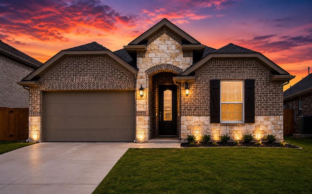 Brick and stone facade featuring an arched entryway