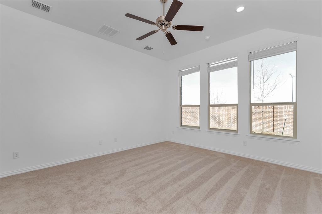 Empty room with ceiling fan, light carpet, vaulted ceiling, and recessed lighting