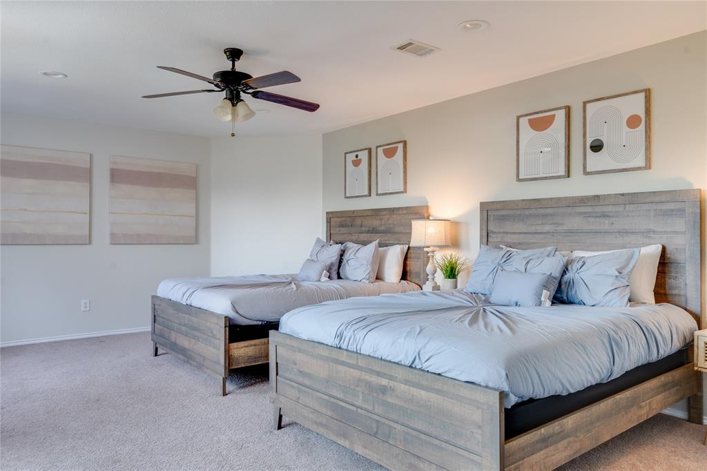 Neutral tone wall paint, recessed lighting, ceiling fan light fixture, and carpet flooring