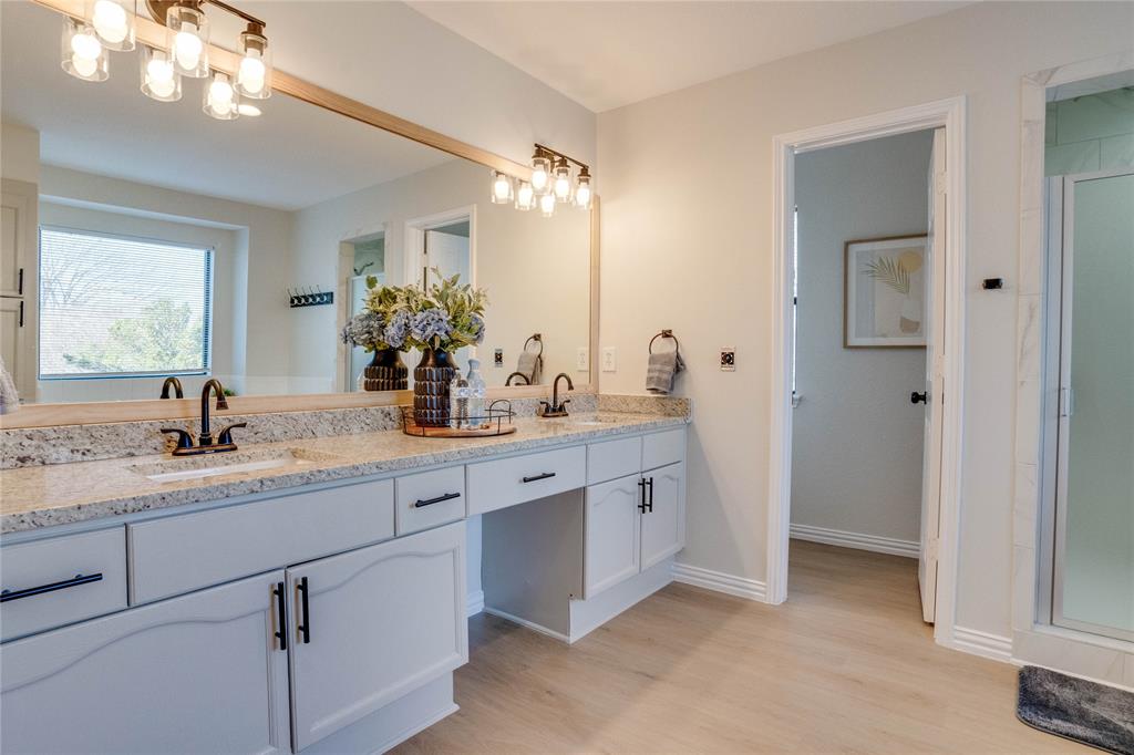 Dual vanity with granite-style countertops and undermount sinks