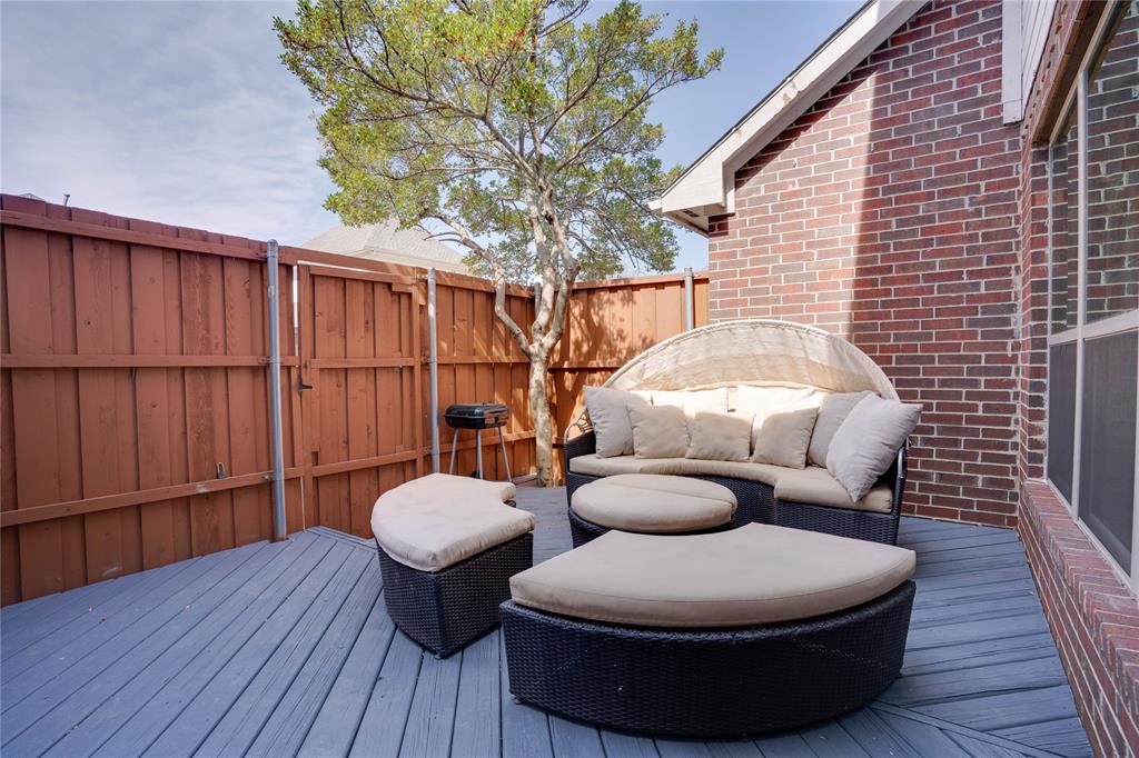 Private deck space featuring gray wood-finish flooring