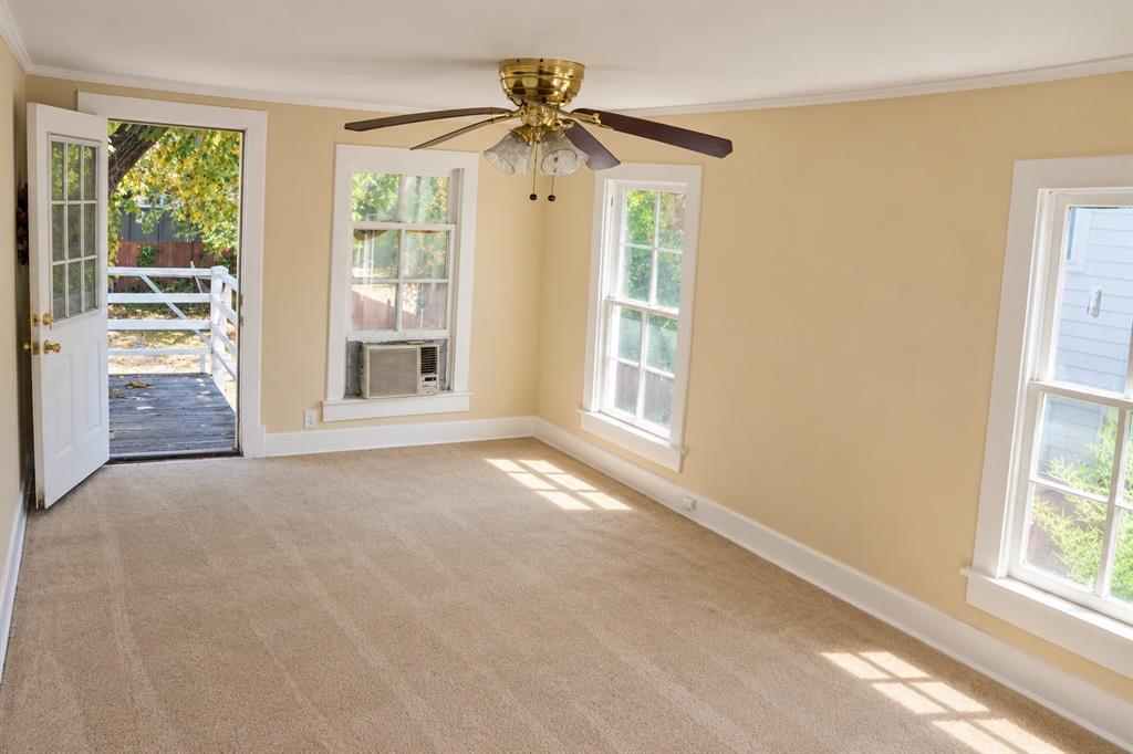 Upper-level room showing exterior deck door access