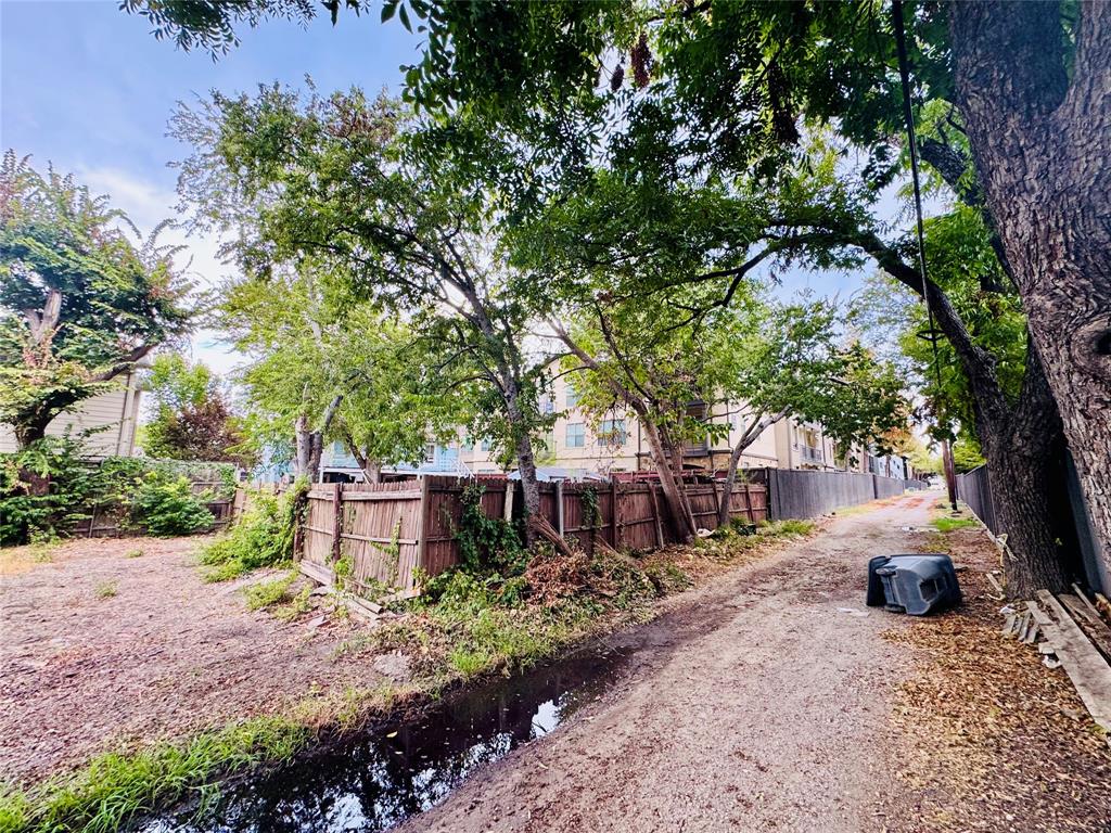 Dedicated rear alley access behind property gate.