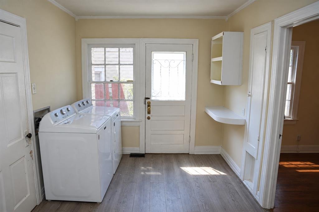 Dedicated laundry and utility room in front structure.