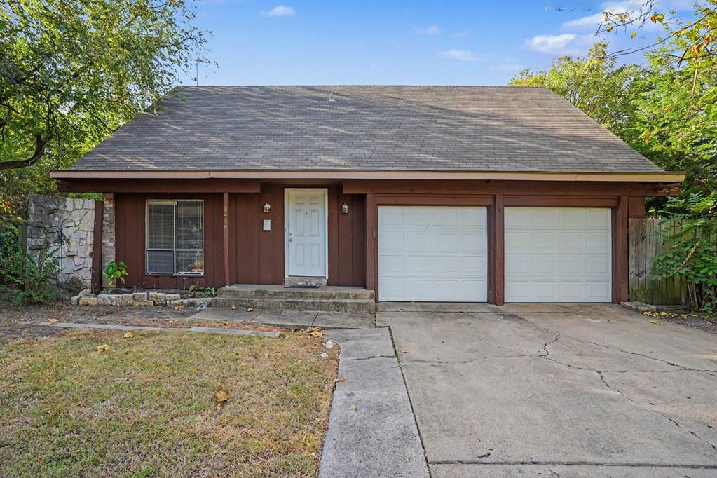 Exterior featuring a brown facade, a two-car garage, and a concrete driveway Exterior featuring a brown facade, a two-car garage, and a concrete driveway