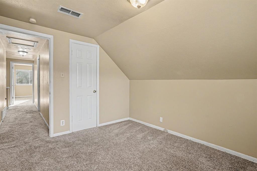 Wall-to-wall carpeting and neutral wall tones