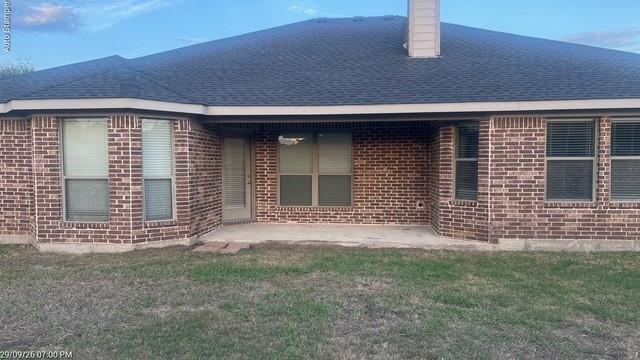 Brick exterior with an asphalt shingle roof