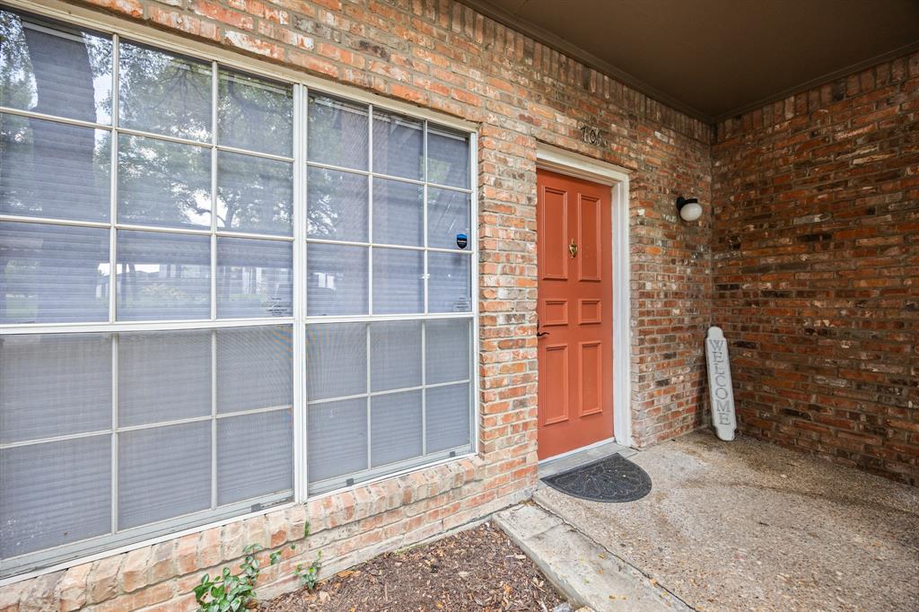 Brick exterior with a covered entry