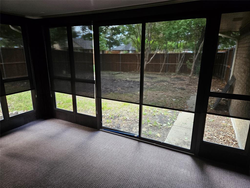Custom roller shades partially down to give privacy and shade from sun.