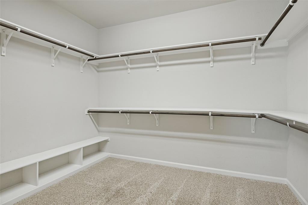 Large walk-in closet with built-ins