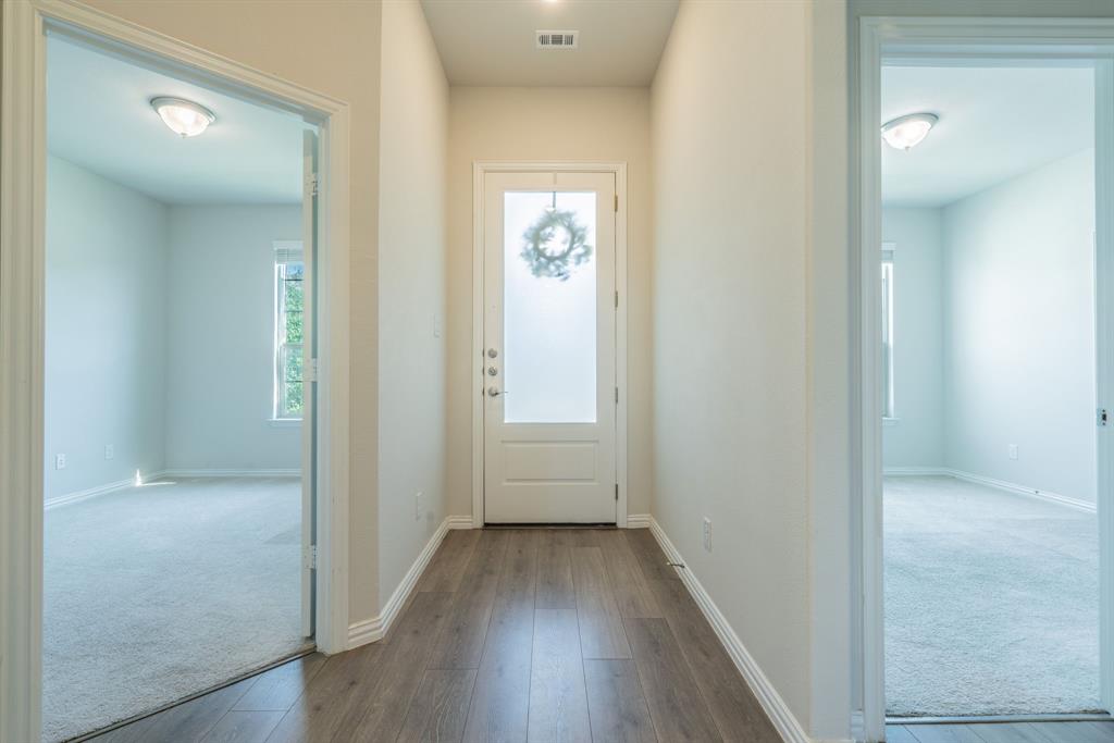 Entry way to open living area with bedrooms on either side