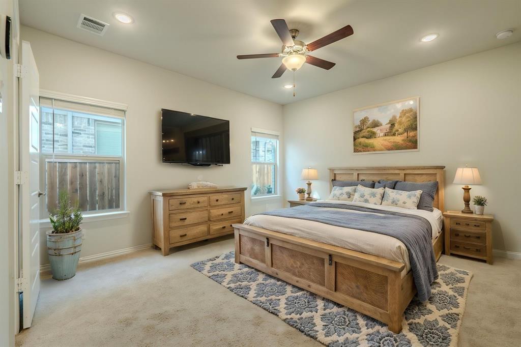 Virtually staged primary bedroom on main floor
