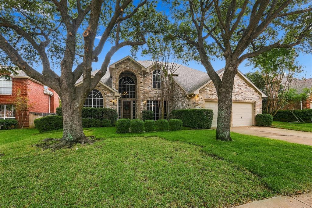 A GRAND ENTRANCE TO EXCEPTIONAL LIVING! Framed by majestic mature trees and beautifully established landscaping, this striking two-story brick residence commands attention with its timeless architecture, dramatic arched windows, and sophisticated curb appeal. A captivating first impression that perfectly sets the stage for the elegance and grandeur found within!