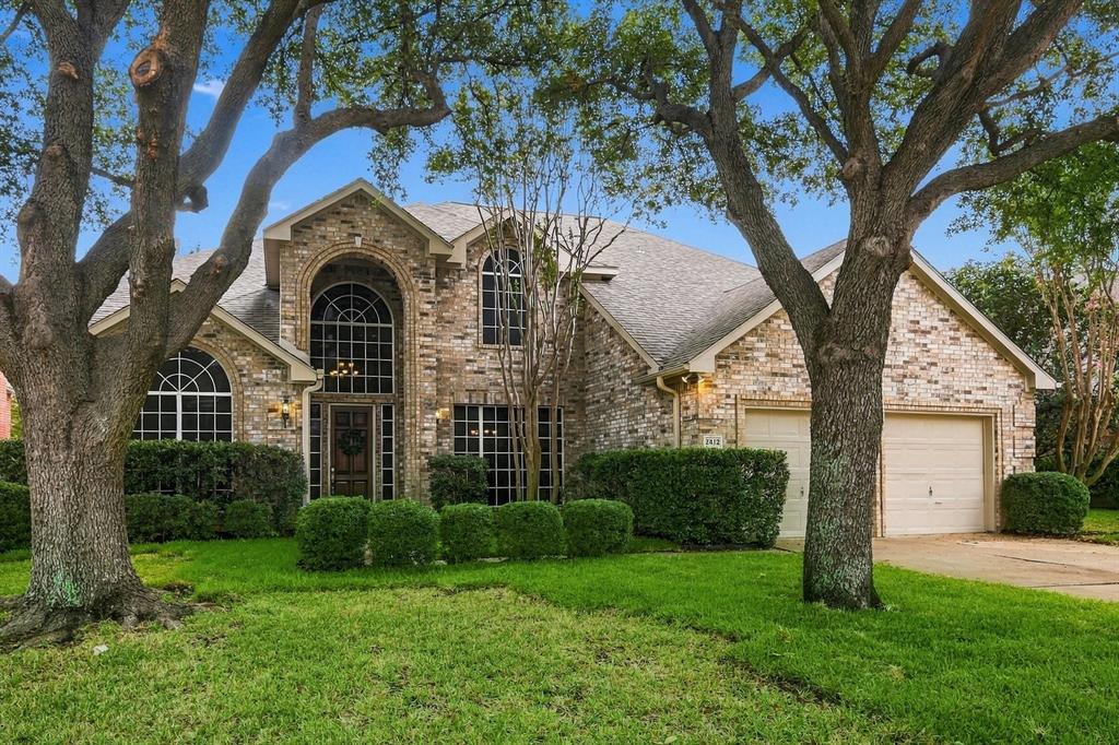 TIMELESS ELEGANCE FROM THE MOMENT YOU ARRIVE! This magnificent two-story brick residence makes an unforgettable first impression with striking architectural details, majestic mature trees, lush landscaping. A beautiful combination of classic sophistication and undeniable curb appeal!