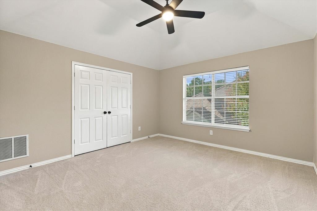 COMFORT MEETS TIMELESS CHARM! This inviting bedroom features a generous layout, soft neutral finishes, fresh carpet and paint, a stylish ceiling fan, and abundant natural light. A beautiful retreat with ample closet space and endless possibilities for personalization.