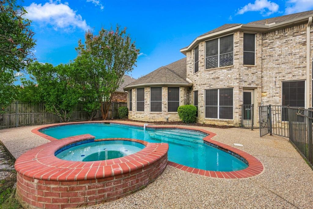 Resort-style outdoor living takes center stage with a refreshing pool, raised spa and an inviting backyard designed for both quiet relaxation and effortless entertaining.