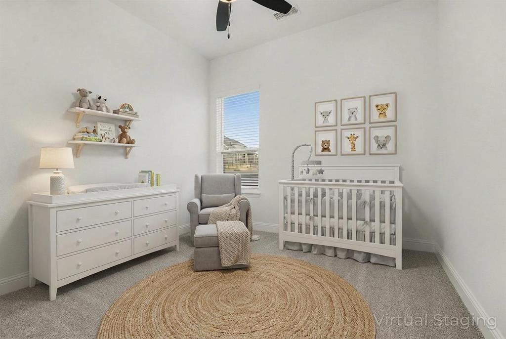 High-ceiling bedroom featuring neutral carpeting, a dual-blade ceiling fan, and a single-pane window