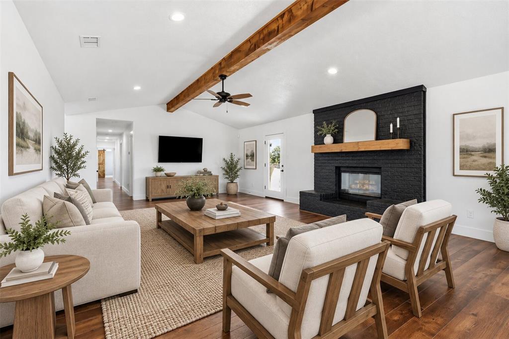 virtually staged living room with dining space behind chairs