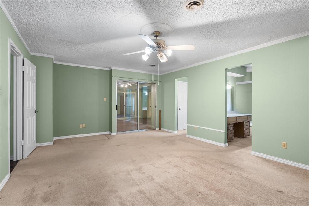Spacious primary bedroom with ample room for a sitting area