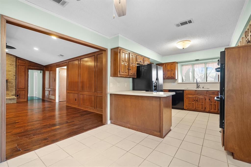 Bright kitchen featuring a charming bay window above the sink