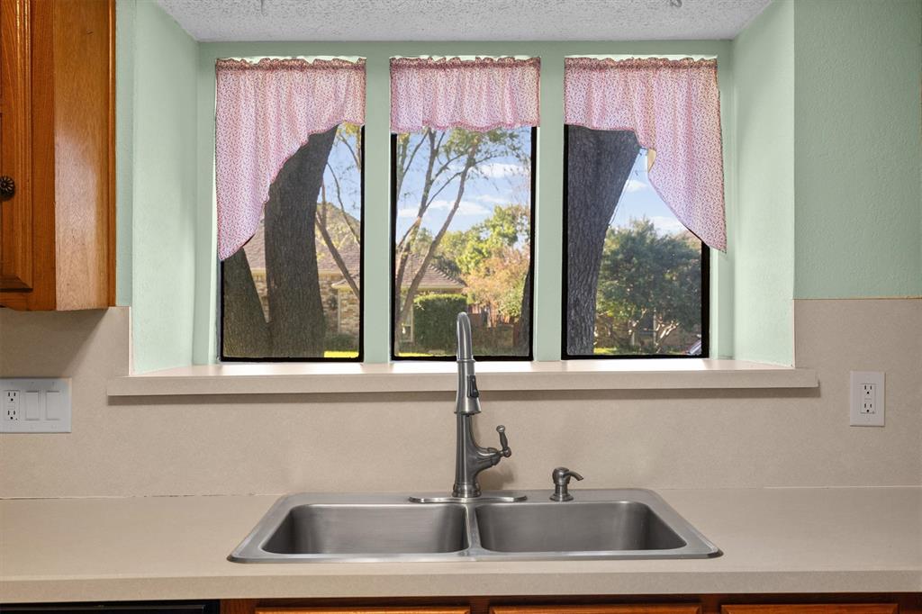 Bay window above the sink—perfect for indoor plants or herbs