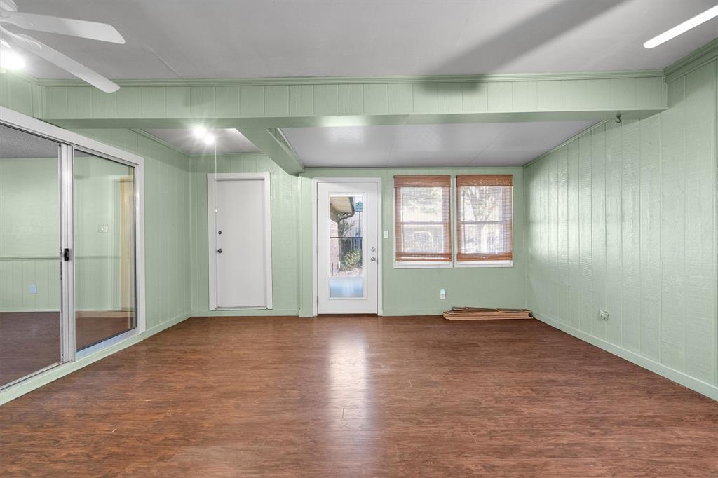 Versatile enclosed patio with seamless access to the yard and garage