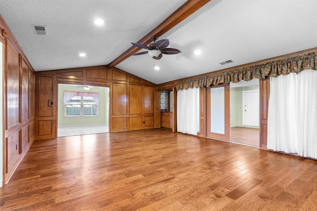 Another view of living room adjacent to breakfast area and enclosed patio