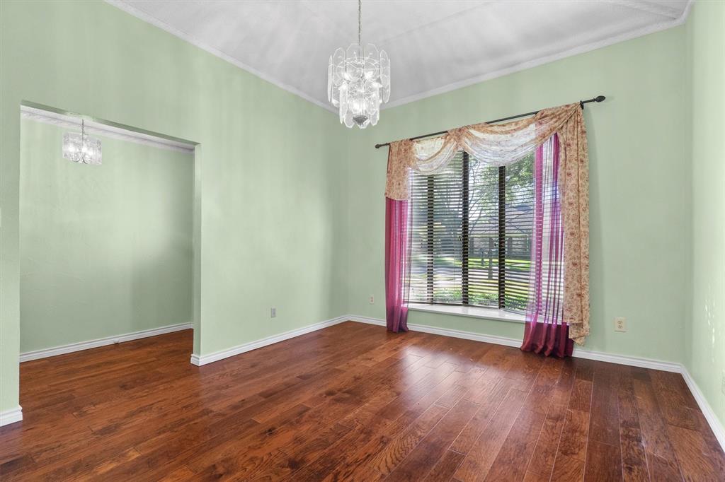 Bright dining area featuring a bay window with front views