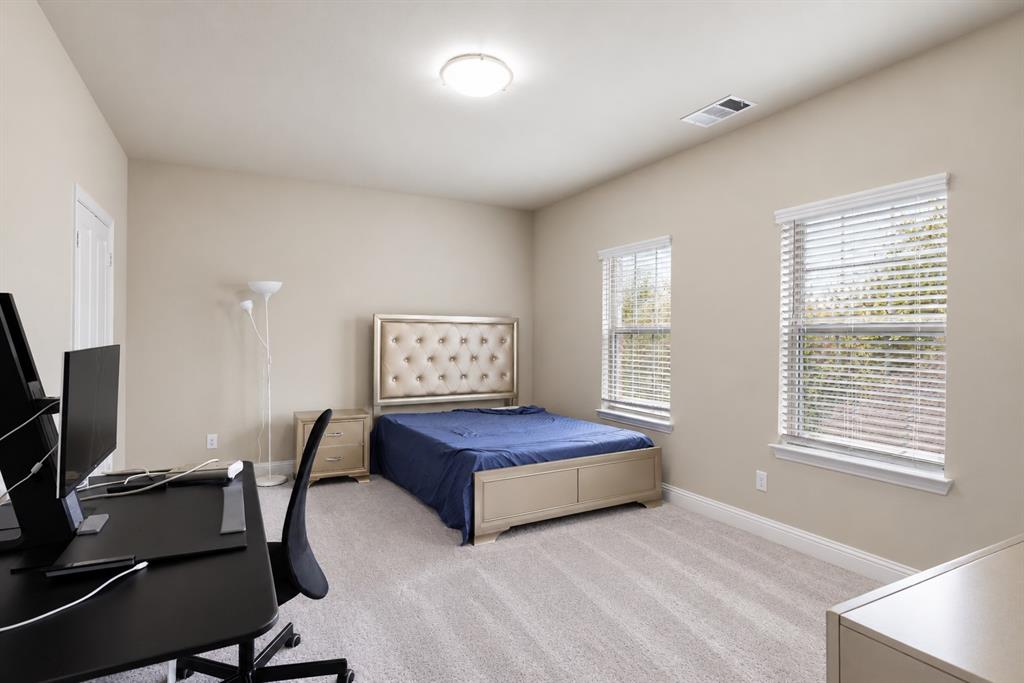 Neutral-toned walls complement the light-colored carpeting