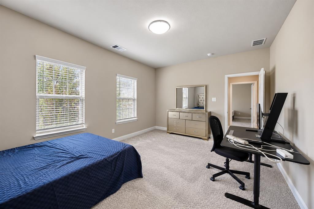 Plush carpet flooring complements neutral wall tones
