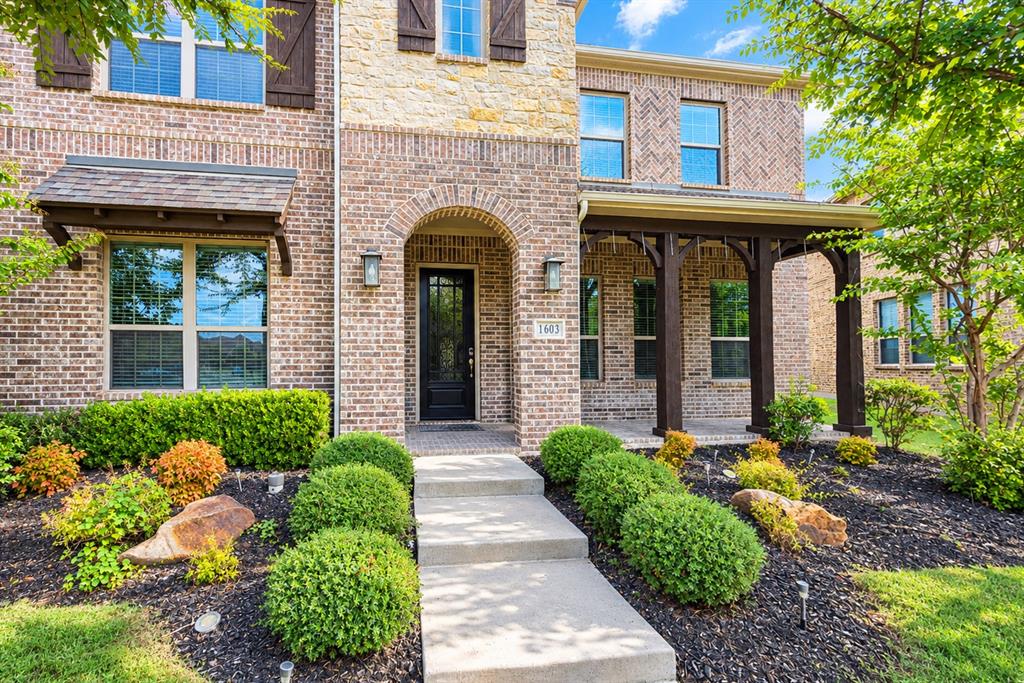 Brick and stone exterior with arched entry