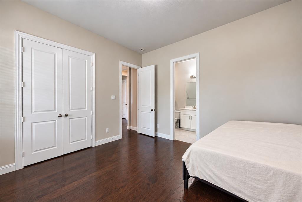 Rich wood-finish flooring with light-toned walls