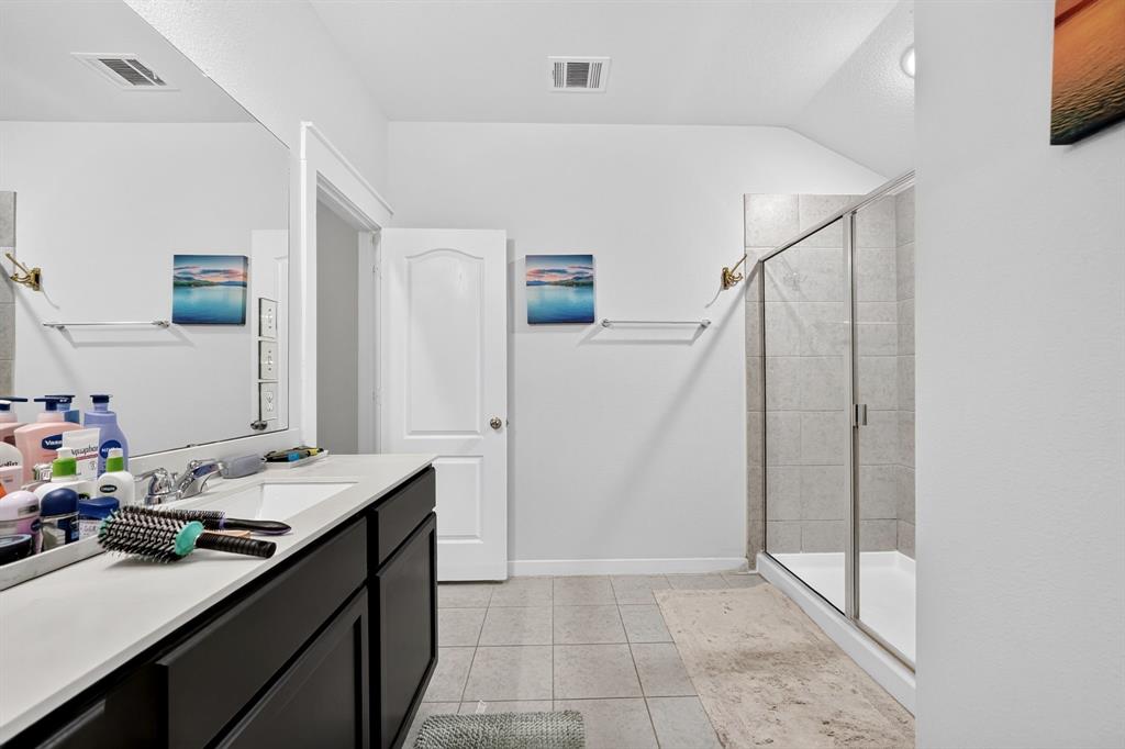 Light gray wall paint, white trim, paneled interior doors, and gray carpet flooring