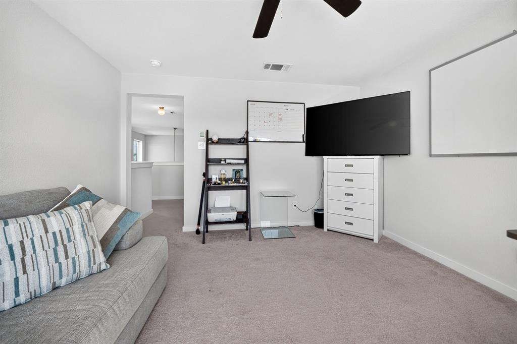 Neutral-toned wall-to-wall carpeting throughout