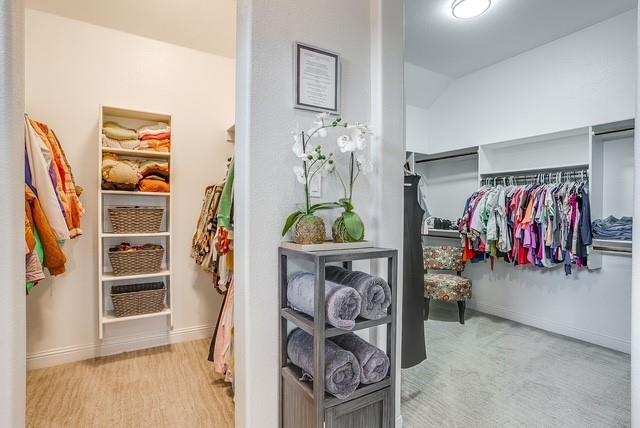 Separate oversized walk in closets in primary bath