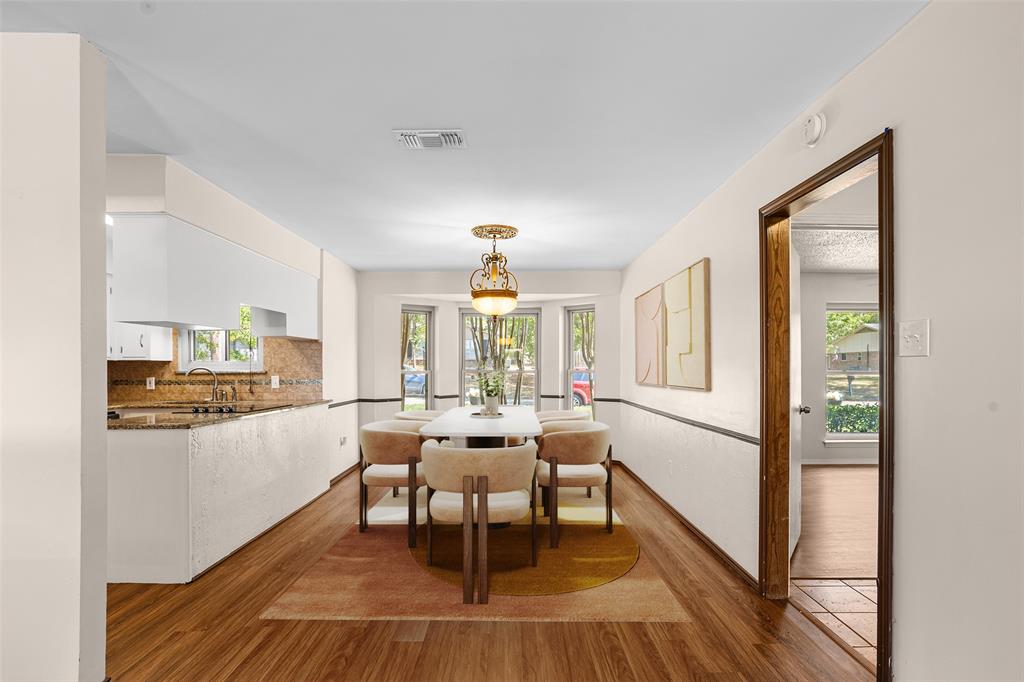 Wood-finish flooring throughout the dining area