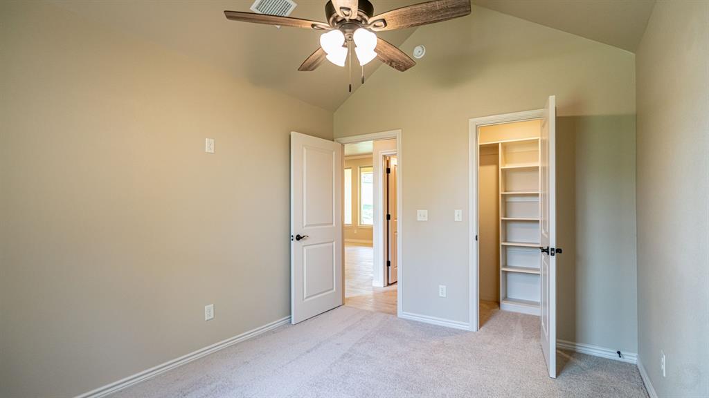 Secondary bedroom with walk in closet