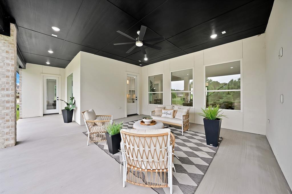 Covered patio featuring a black ceiling, recessed lighting, and a ceiling fan Covered patio featuring a black ceiling, recessed lighting, and a ceiling fan