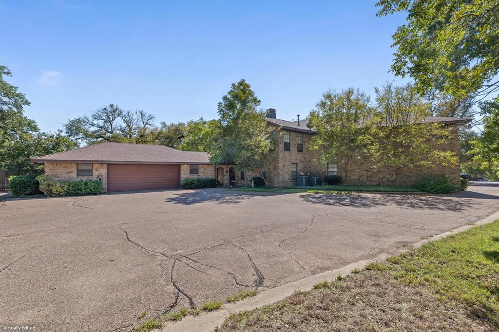 Brick exterior construction with a brown garage door