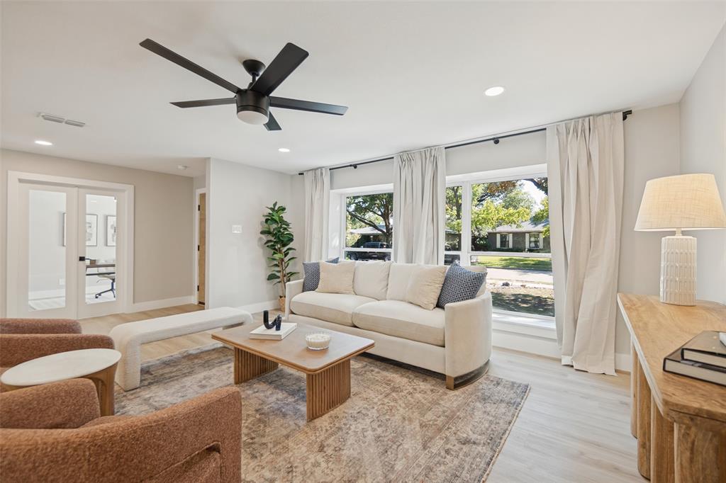Recessed lighting, wood-finish flooring, and a modern ceiling fan