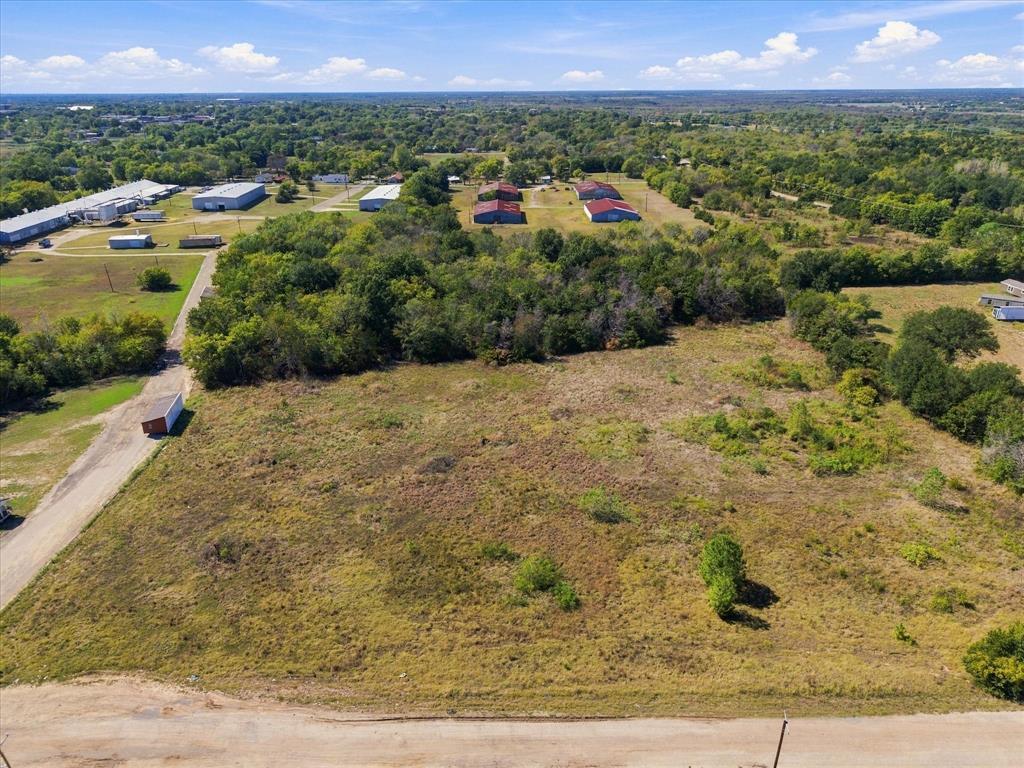 Tree lined acreage provides privacy for your home or rental properties!