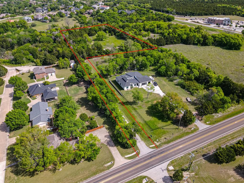 Expansive treed lot with a paved road frontage Expansive treed lot with a paved road frontage