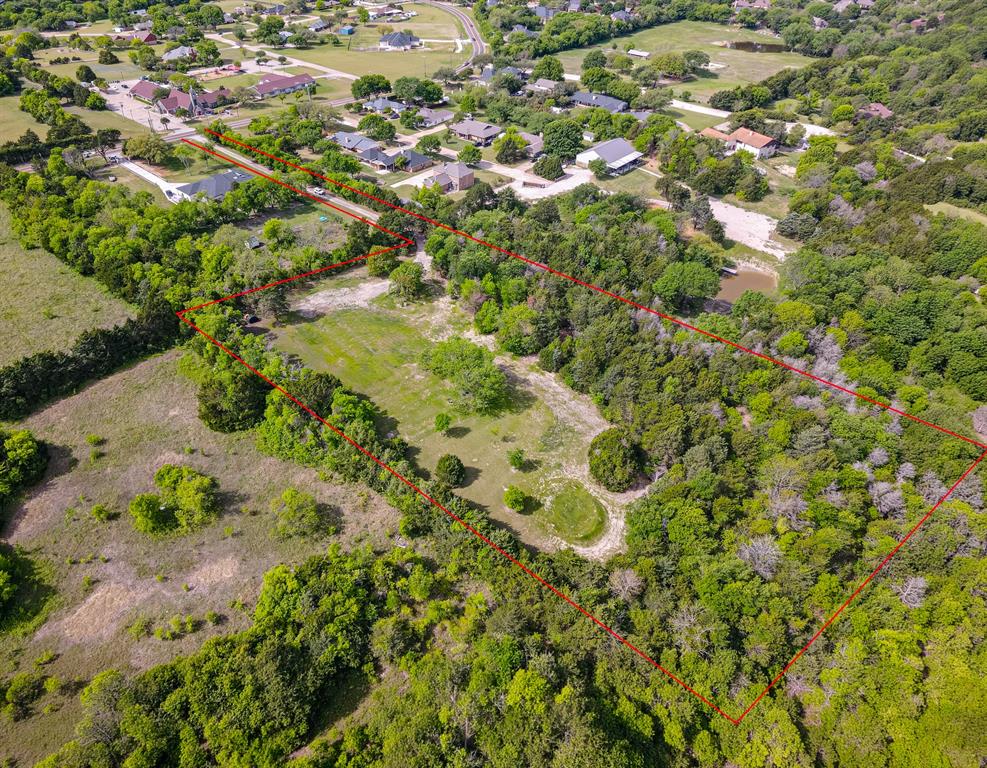 Expansive lot featuring a combination of cleared land and mature trees Expansive lot featuring a combination of cleared land and mature trees