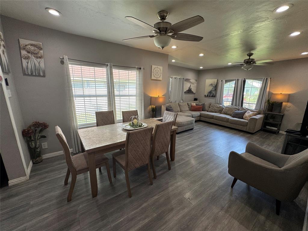 Dining room with recessed lighting, ceiling fan, and dark wood-style flooring