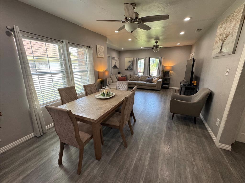 Dining room featuring recessed lighting, ceiling fan, dark wood finished floors, and a textured wall
