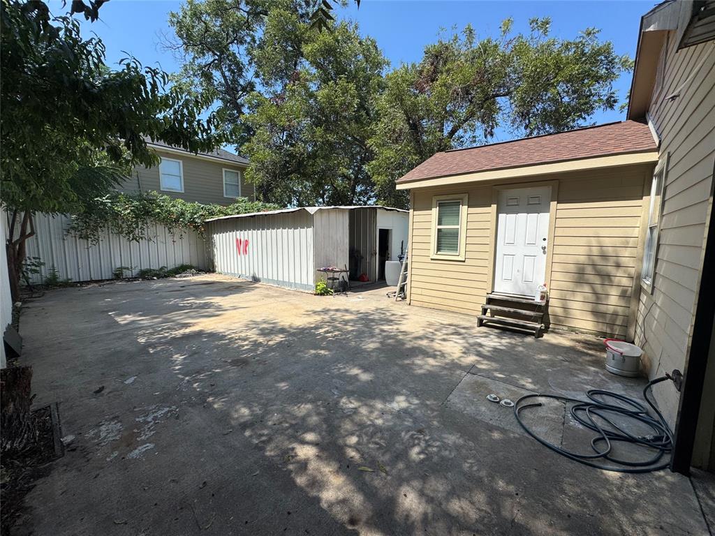 View of patio with an outbuilding